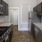 a kitchen with black cabinets