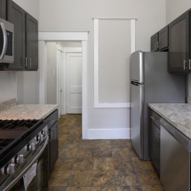 Spacious kitchens with thoughtful details a kitchen with black cabinets