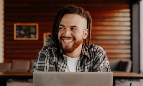 a man smiling at the camera